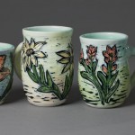 cups (flowers: lily, black-eye susan, indian paintbrush, clover)